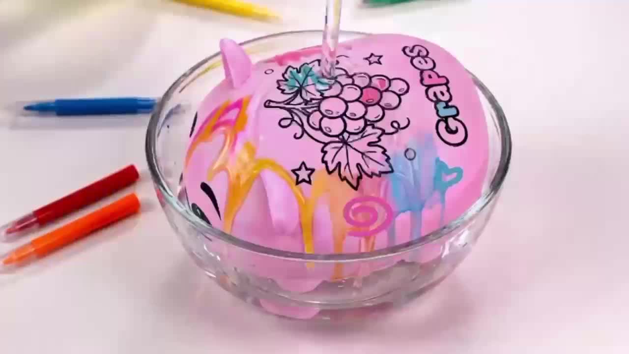 The grape character in water during the wash scene of the Color V2 spot